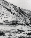 Lone horseback rider and Peruvian Ridge in the immediate background